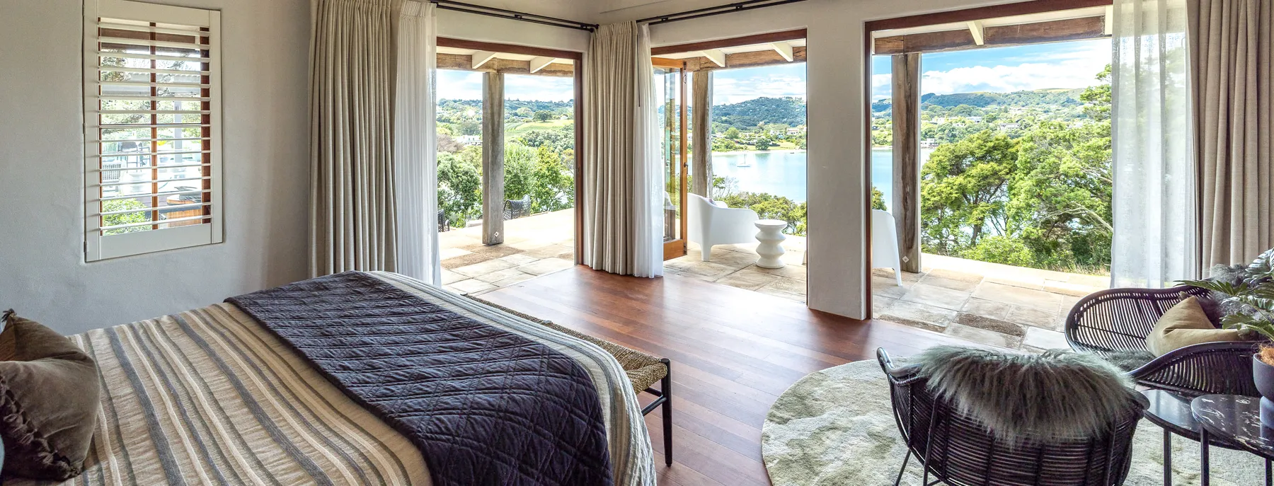 Photo of master bedroom looking out over the bay